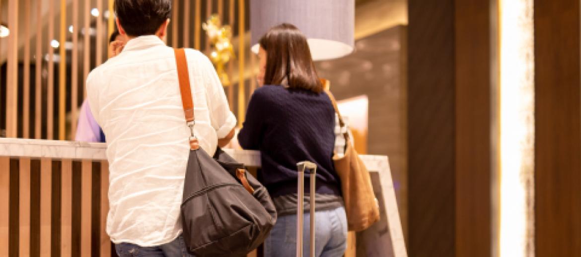 Guests checking into hotel