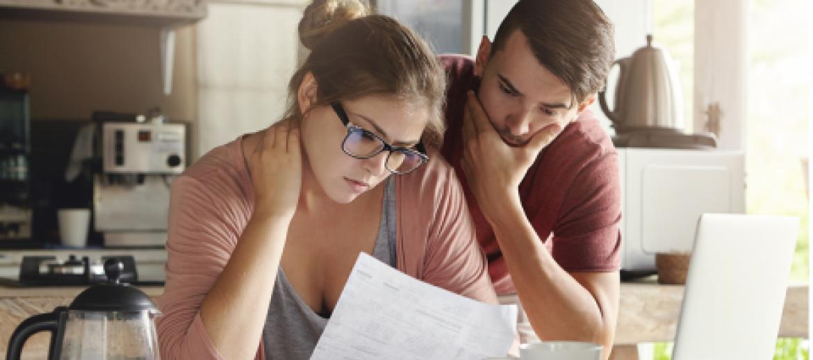 young couple worrying about personal debt