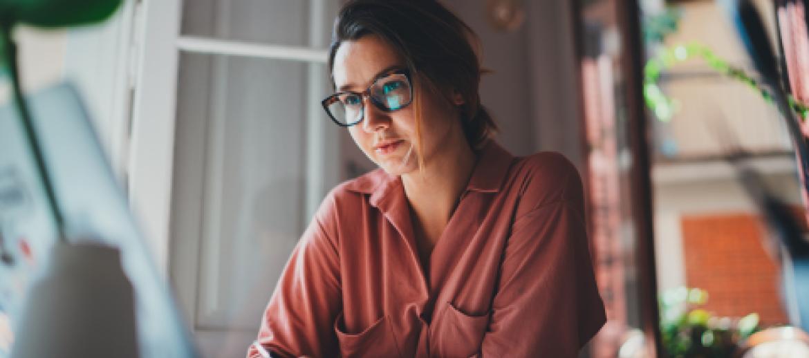 Woman employee working on laptop