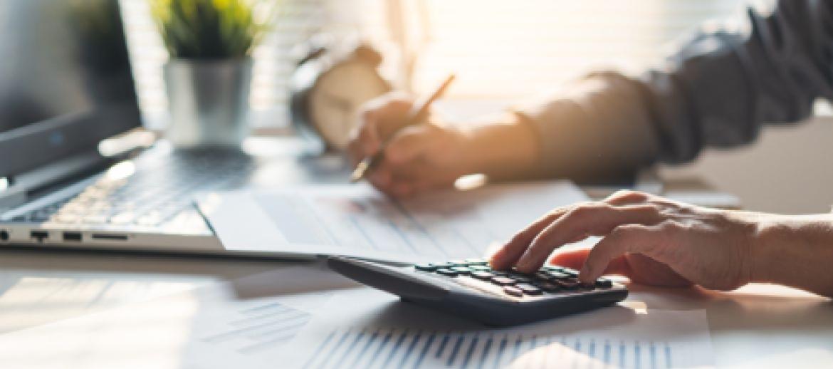man playing with calculator