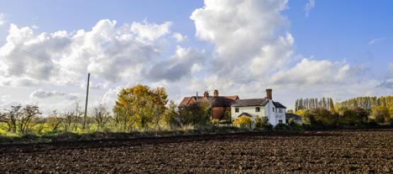 UK farmhouse surrounded by farmland