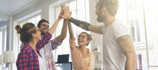 Entrepreneurs giving high-fives to each other