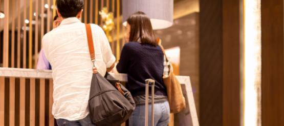 Guests checking into hotel