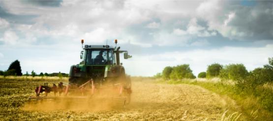 Tractor ploughing on farmland in the UK