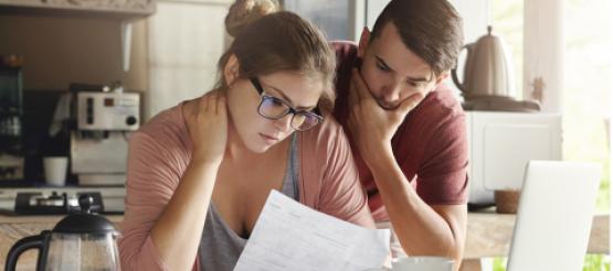 young couple worrying about personal debt