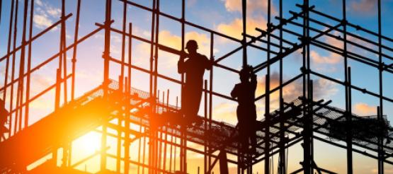 Construction workers on scaffolding 