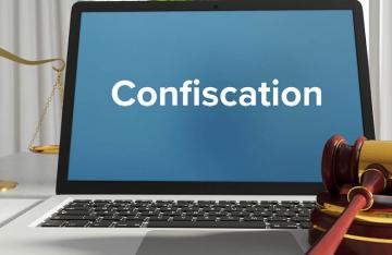 Confiscation typed on laptop