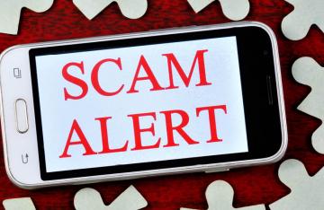 Scam alert on mobile phone