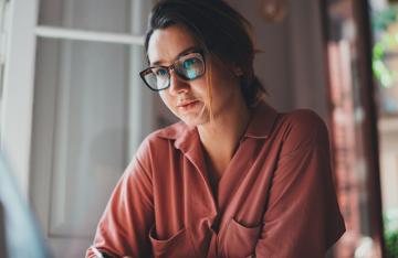 Woman employee working on laptop