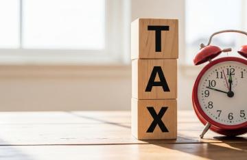 Clock alongside tax blocks