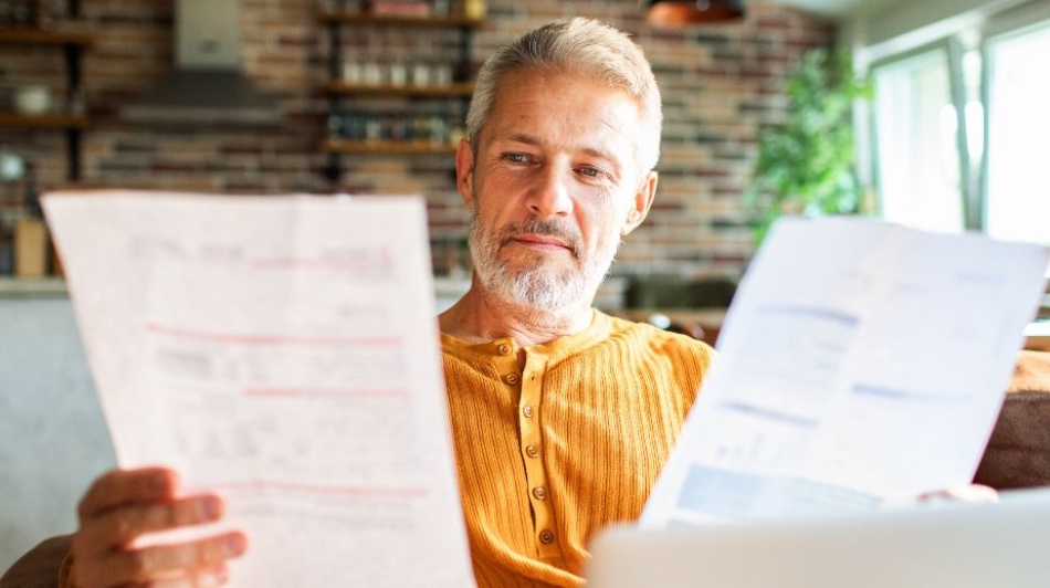 man reading papers