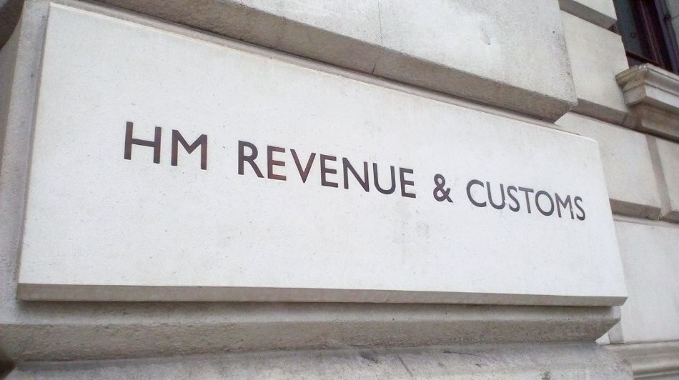 HM Revenue & Customs sign mounted on a stone government building exterior.