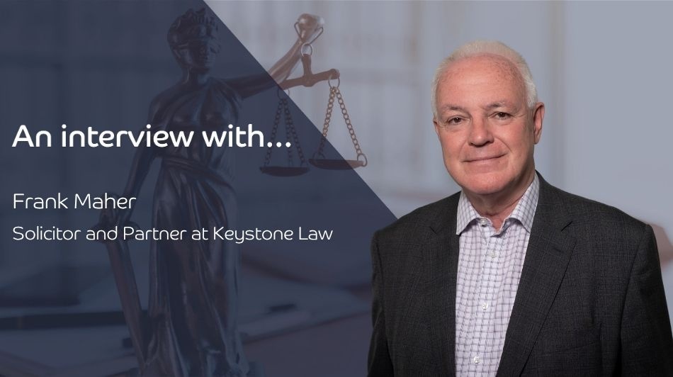 Interview banner with Frank Maher, Solicitor and Partner at Keystone Law, beside a Lady Justice statue.