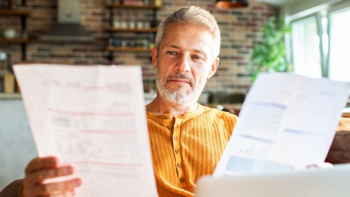 man reading papers