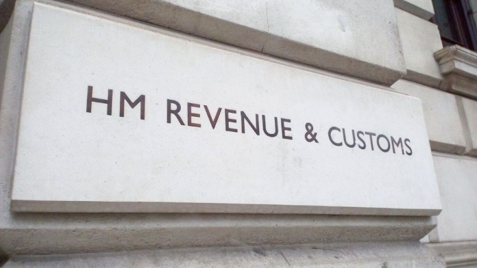 HM Revenue & Customs sign mounted on a stone government building exterior.