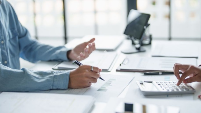 people talking at desk