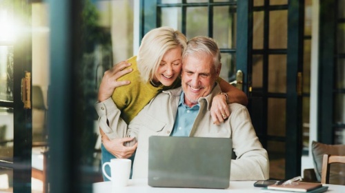 Couple looking at a laptop 