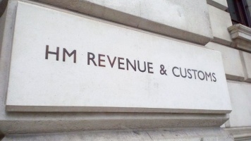 HM Revenue & Customs sign mounted on a stone government building exterior.