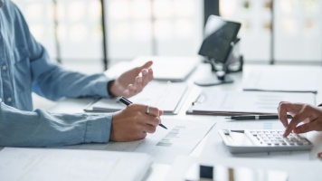 people talking at desk