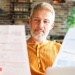 man reading papers
