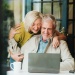 Couple looking at a laptop 