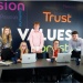 Tax Compliance Managers and apprentices at Armstrong Watson. Sitting at a desk with lap
