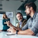 Business team discussing a project during a meeting in a modern office conference room.