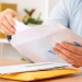 Person opening a letter